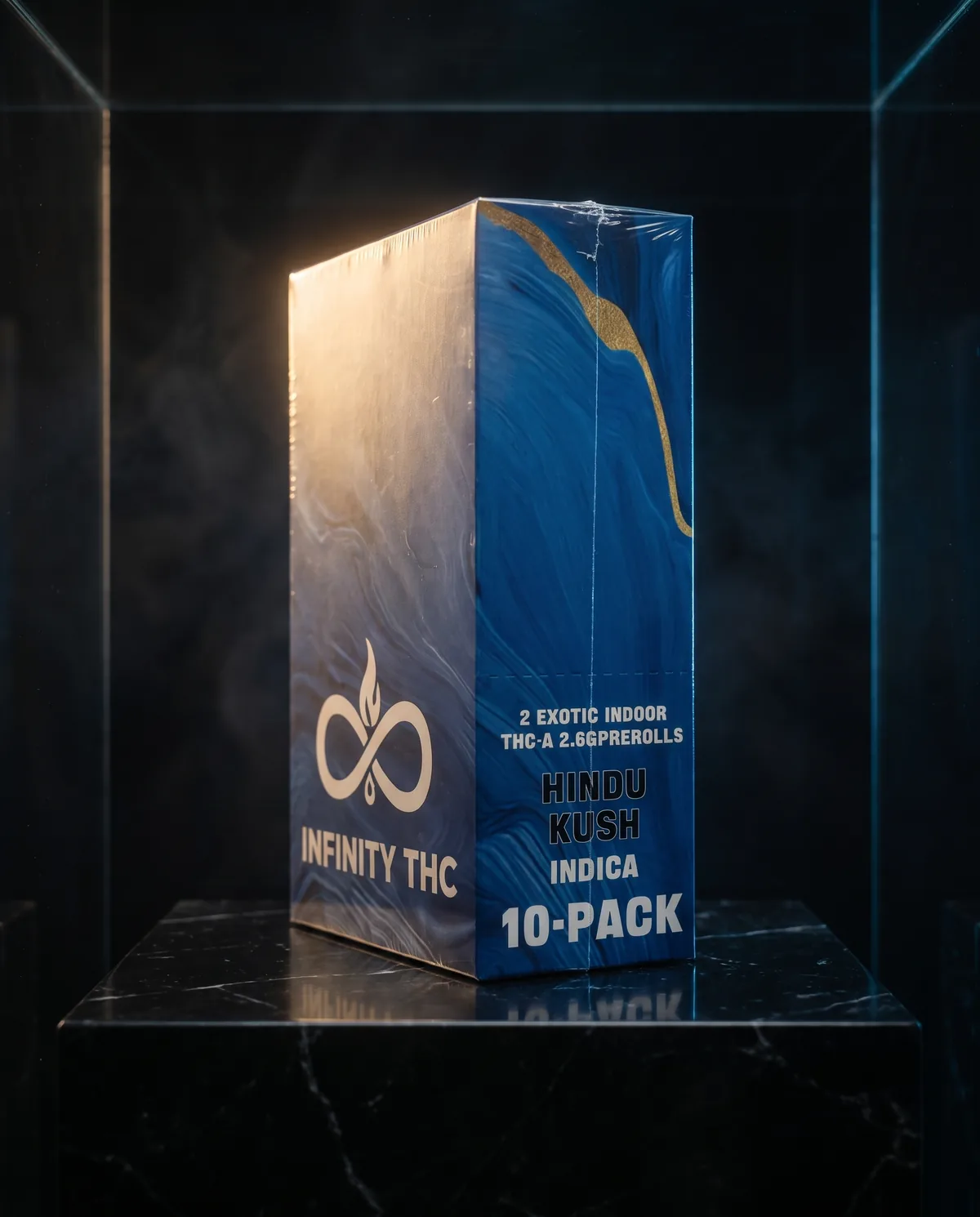 Blue marbled Infinity carton turned to show its side panel, on a black marble plinth in a dark display case